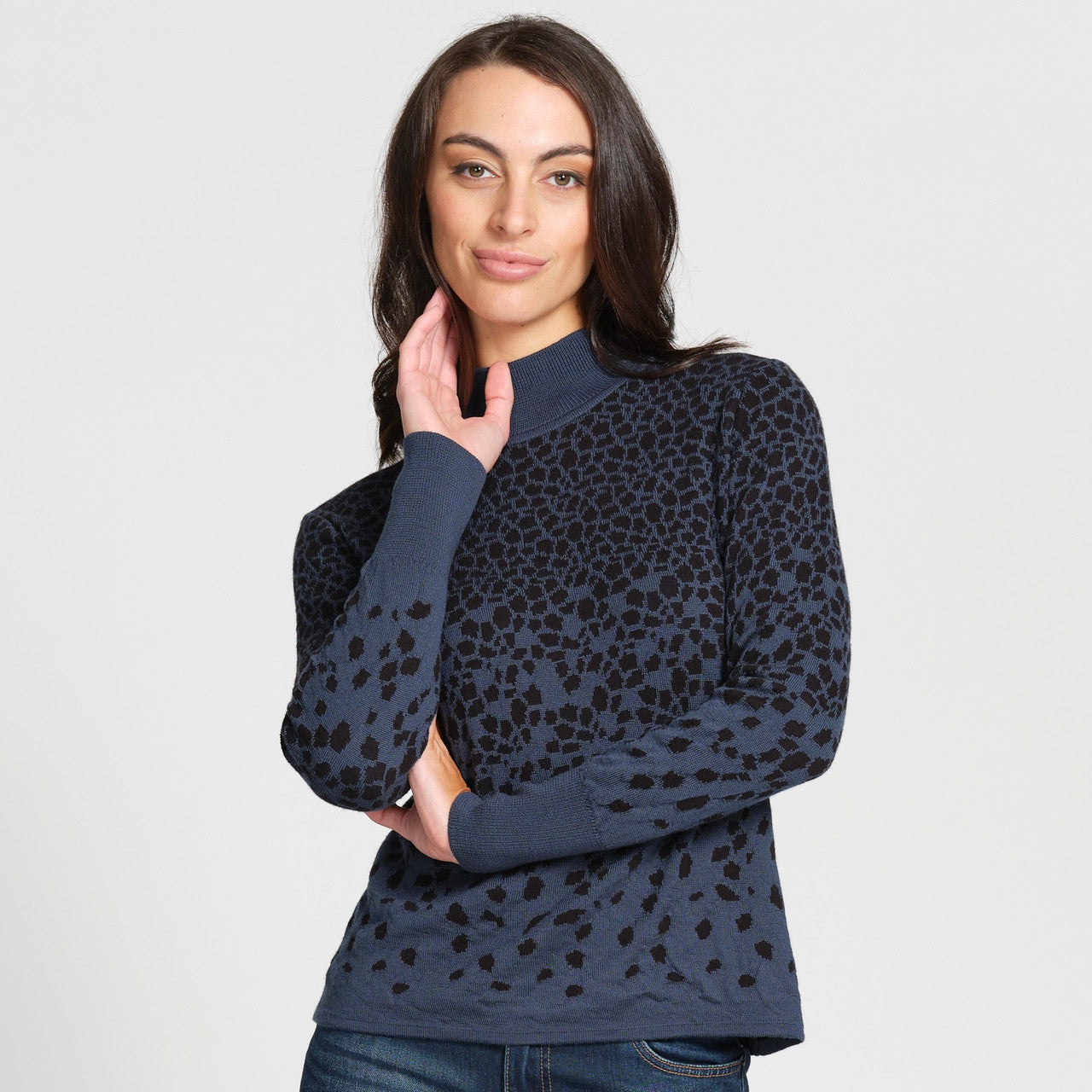 Woman wearing top in Teal/Black.