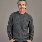 Man wearing McDonald - Merino & Possum Patchwork Sweater (6641) in the colour Pewter