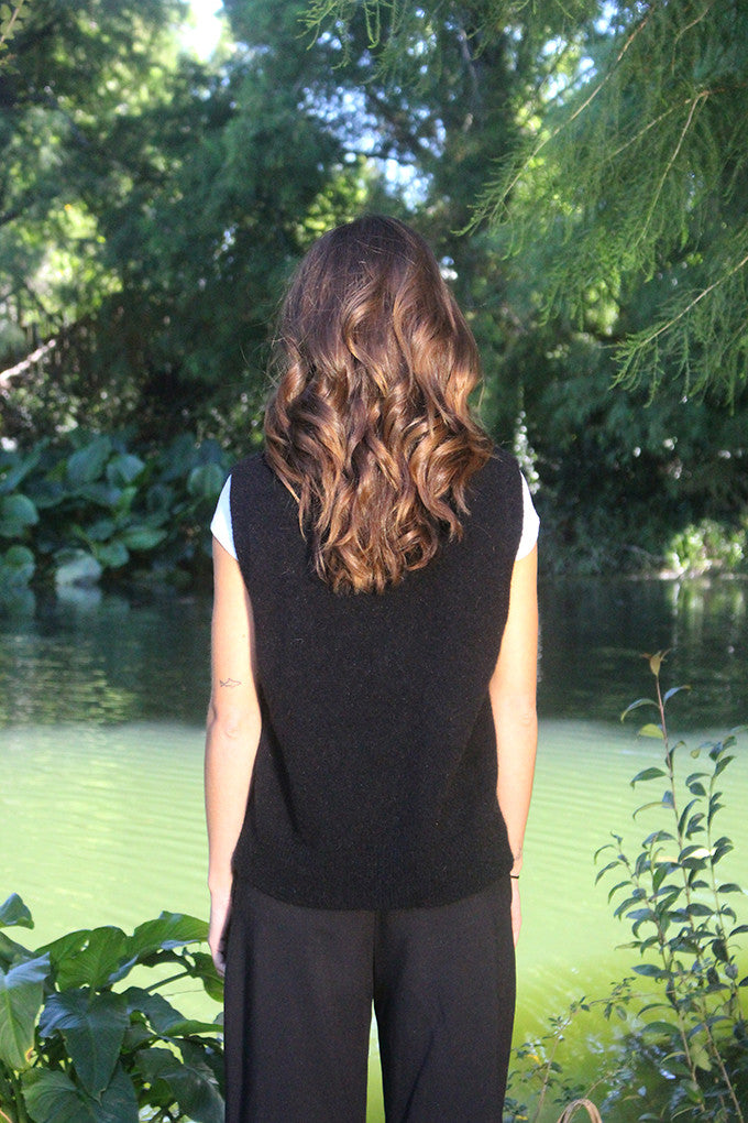 Woman wearing the Lothlorian - Merino & Possum Ride Vest (9650) in the colour Black.