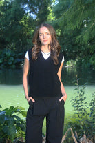 Woman wearing the Lothlorian - Merino & Possum Ride Vest (9650) in the colour Black.