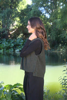 Woman wearing the Lothlorian - Merino & Possum Ride Vest (9650) in the colour Moss.