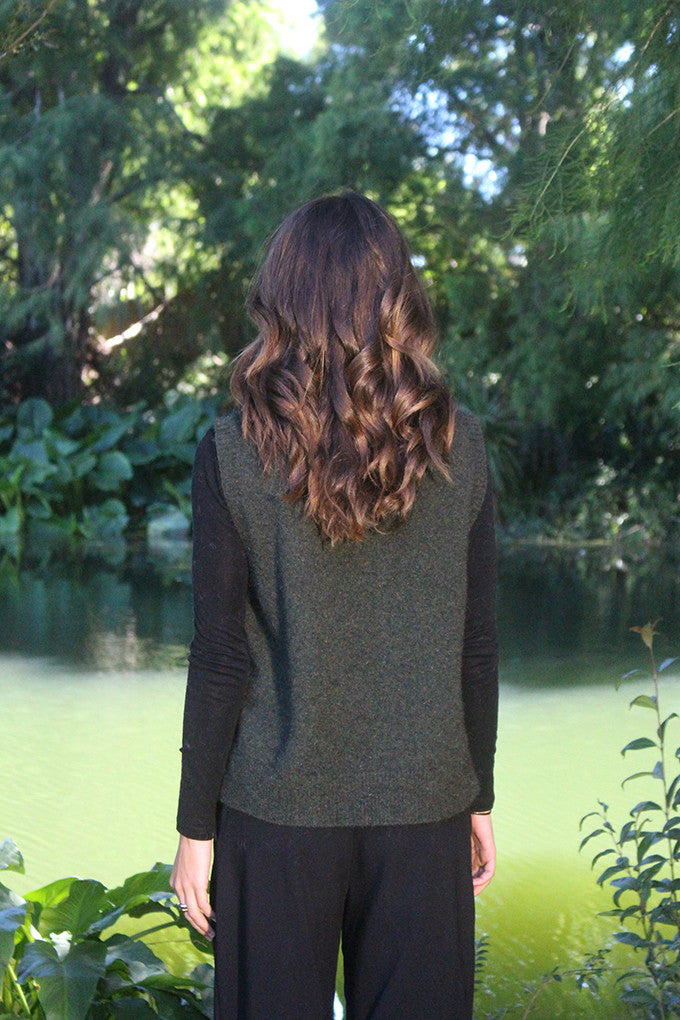 Woman wearing the Lothlorian - Merino & Possum Ride Vest (9650) in the colour Moss.