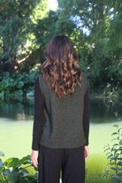 Woman wearing the Lothlorian - Merino & Possum Ride Vest (9650) in the colour Moss.