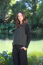 Woman wearing the Lothlorian - Merino & Possum Ride Vest (9650) in the colour Moss.
