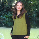 Woman wearing the Lothlorian - Merino & Possum Ride Vest (9650) in the colour Olive.