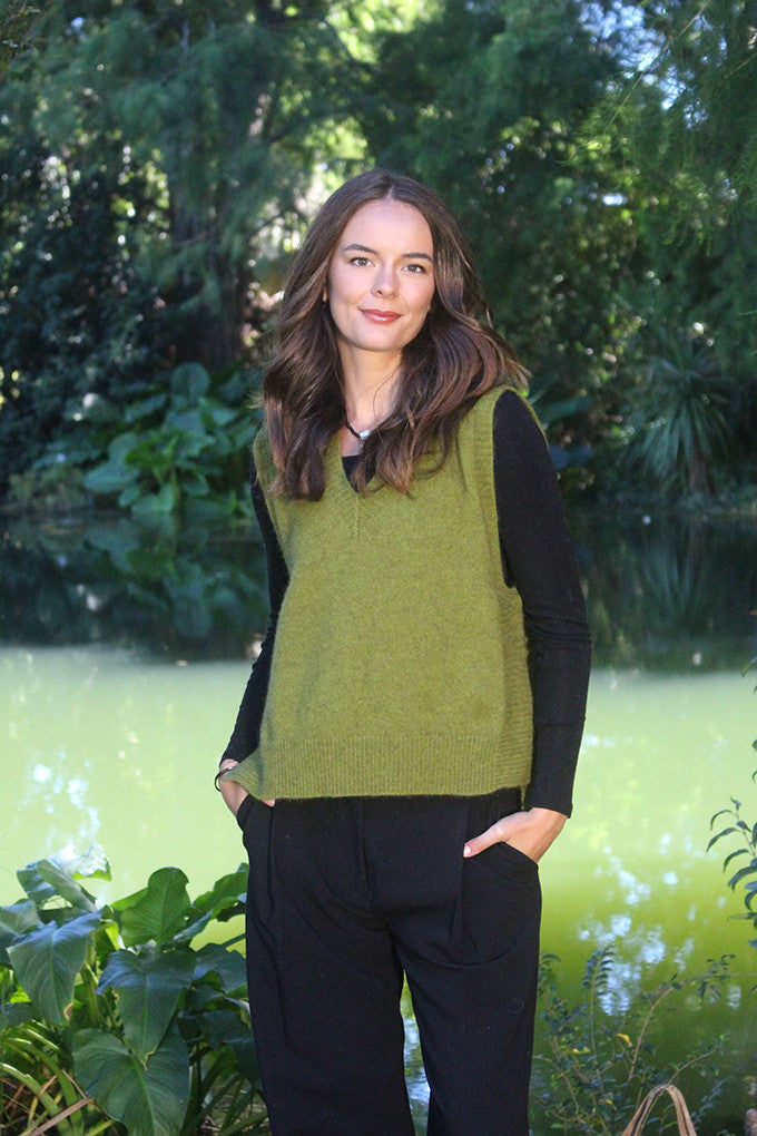 Woman wearing the Lothlorian - Merino & Possum Ride Vest (9650) in the colour Olive.