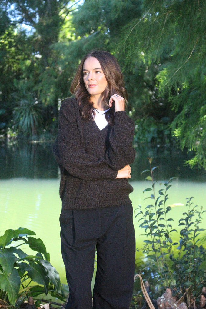 Woman wearing the Lothlorian - Merino & Possum Cavern V Neck Jumper (9789) in the colour Brown Marl.