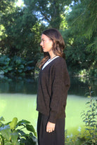 Woman wearing the Lothlorian - Merino & Possum Cavern V Neck Jumper (9789) in the colour Brown Marl.