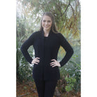 Woman with hands on hips wearing Black relaxed jacket