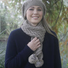 Natural-Woman smiling in forest. wearing scarf and beanie