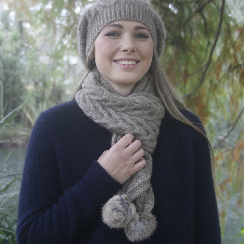 Natural-Woman smiling in forest. wearing scarf and beanie