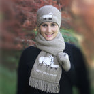 Woman wearing beanie and scarf with sheep picture