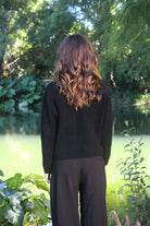 Woman wearing the Lothlorian - Merino & Possum Fuse Tie Jacket (9972) in the colour Black.