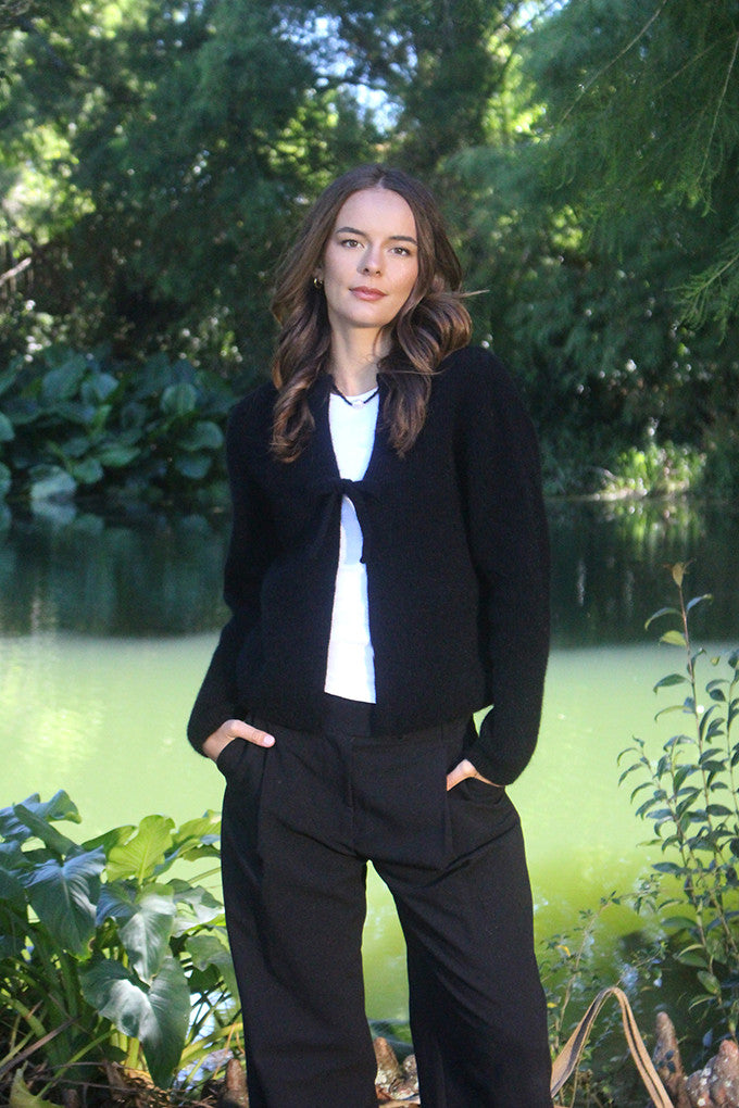 Woman wearing the Lothlorian - Merino & Possum Fuse Tie Jacket (9972) in the colour Black.