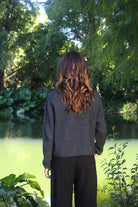 Woman wearing the Lothlorian - Merino & Possum Fuse Tie Jacket (9972) in the colour Charcoal.