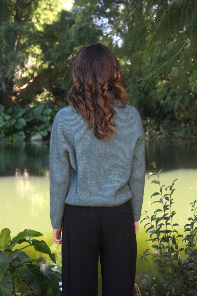 Woman wearing the Lothlorian - Merino & Possum Fuse Tie Jacket (9972) in the colour Sage.