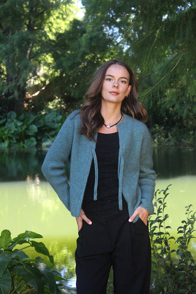 Woman wearing the Lothlorian - Merino & Possum Fuse Tie Jacket (9972) in the colour Sage.