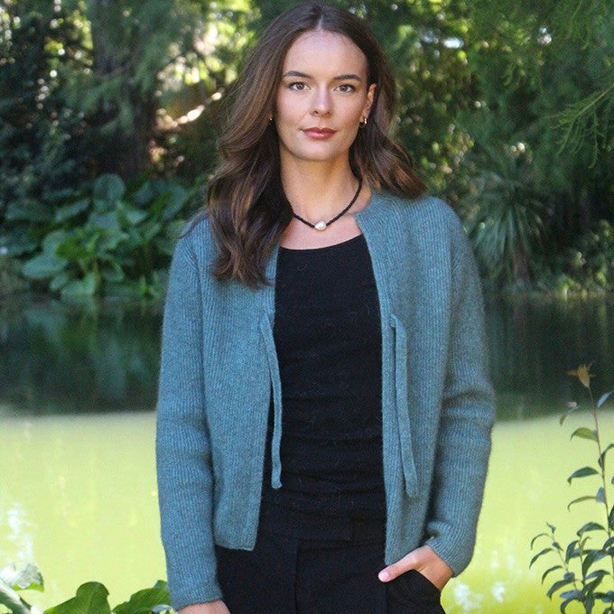 Woman wearing the Lothlorian - Merino & Possum Fuse Tie Jacket (9972) in the colour Sage.