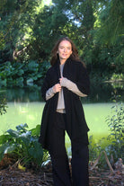 Woman wearing Lothlorian - Merino & Possum Brando Wrap (9993) in the colour Black.