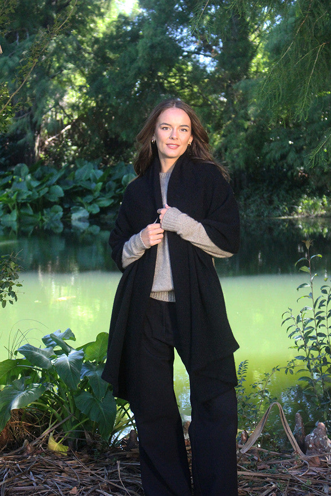 Woman wearing Lothlorian - Merino & Possum Brando Wrap (9993) in the colour Black.