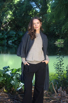 Woman wearing Lothlorian - Merino & Possum Brando Wrap (9993) in the colour Charcoal.
