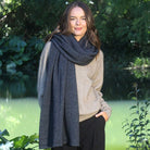 Woman wearing Lothlorian - Merino & Possum Brando Wrap (9993) in the colour Charcoal.