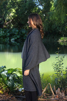Woman wearing Lothlorian - Merino & Possum Brando Wrap (9993) in the colour Charcoal.