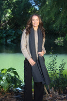 Woman wearing Lothlorian - Merino & Possum Brando Wrap (9993) in the colour Charcoal.
