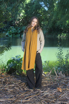 Woman wearing Lothlorian - Merino & Possum Brando Wrap (9993) in the colour Gold.