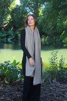 Woman wearing Lothlorian - Merino & Possum Brando Wrap (9993) in the colour Natural.