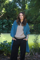 Woman wearing Lothlorian - Merino & Possum Brando Wrap (9993) in the colour Teal.