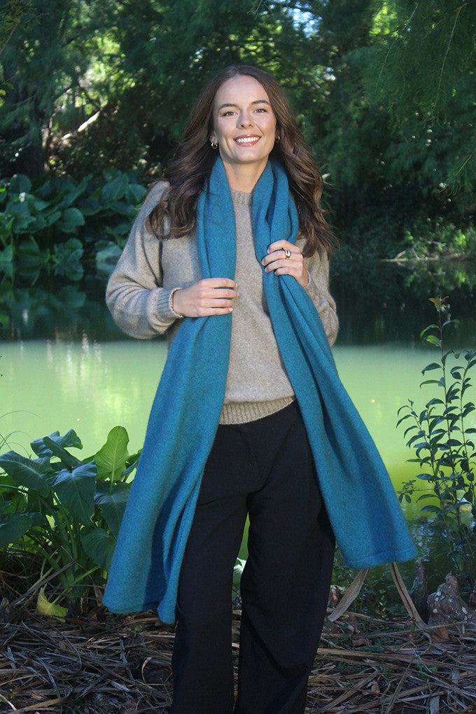 Woman wearing Lothlorian - Merino & Possum Brando Wrap (9993) in the colour Sage.