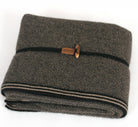 Lightweight blanket folded up. Colour Black/Natural