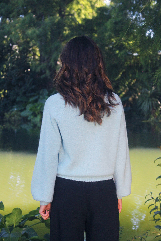Woman wearing the Lothlorian - Alpaca Chime Jumper (ALP079) in the colour Aqua.