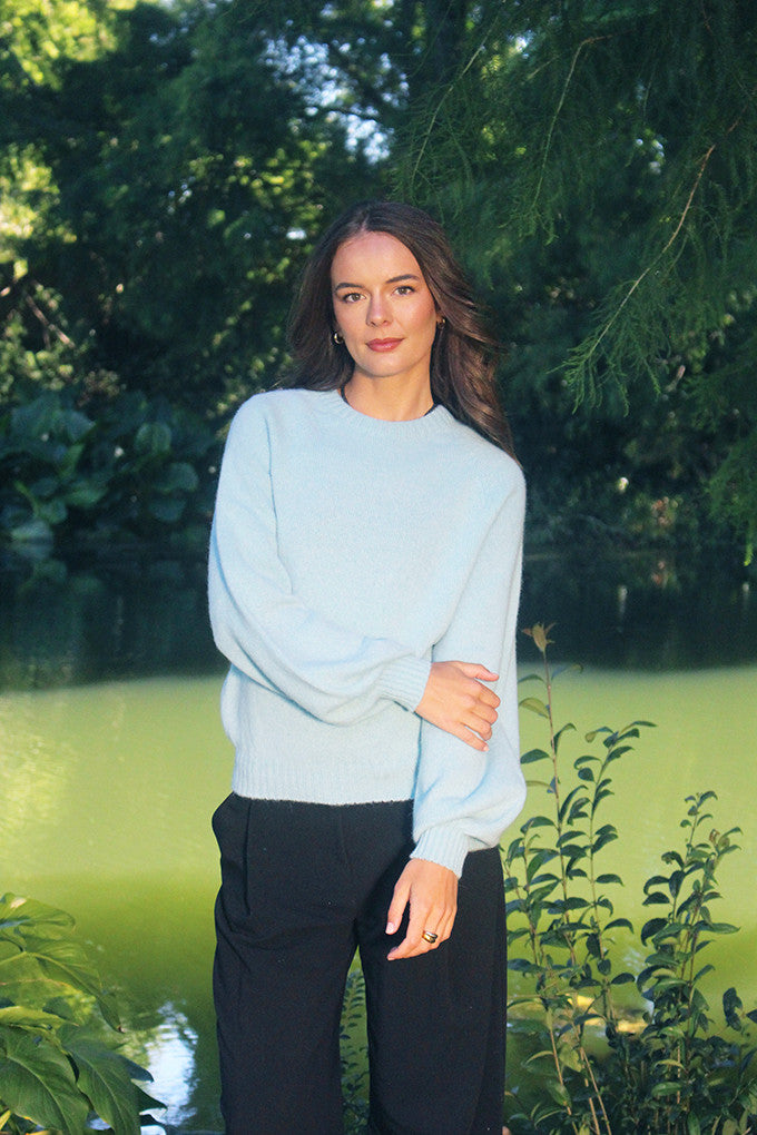 Woman wearing the Lothlorian - Alpaca Chime Jumper (ALP079) in the colour Aqua.