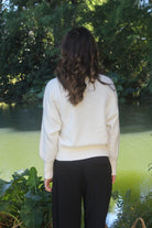 Woman wearing Lothlorian - Alpaca Enclave Cardigan (ALP080) in the colour Natural.