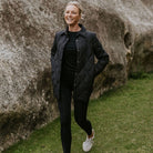 Woman wearing Moke - Ash Down Overshirt in the colour Black.