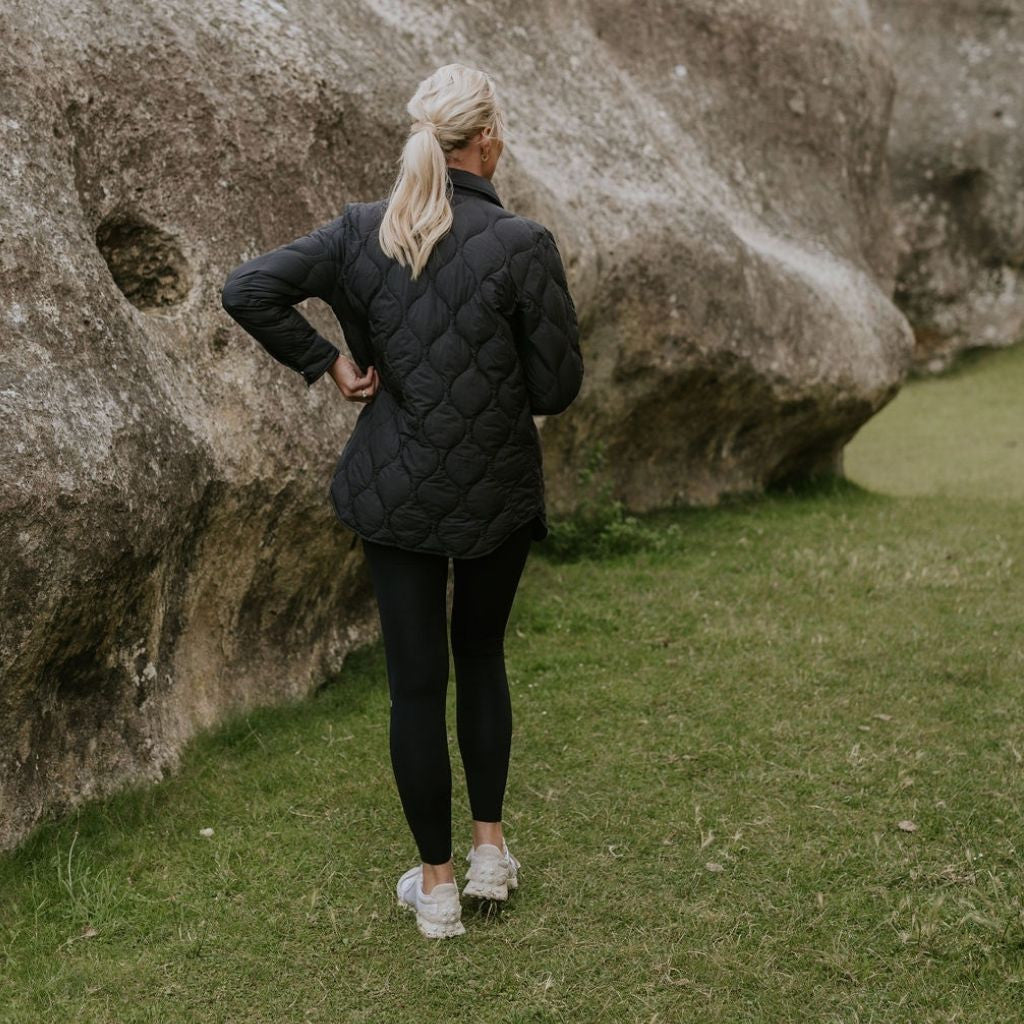 Woman wearing Moke - Ash Down Overshirt in the colour Black.