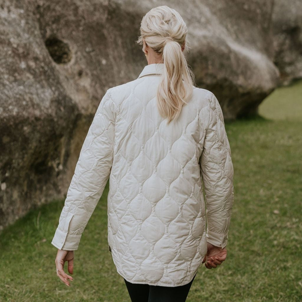 Woman wearing Moke - Ash Down Overshirt in the colour Cream.
