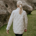 Woman wearing Moke - Ash Down Overshirt in the colour Cream.