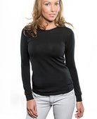 Woman wearing Merino black thermal top.
