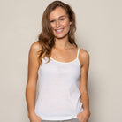 Woman wearing White Camisole.