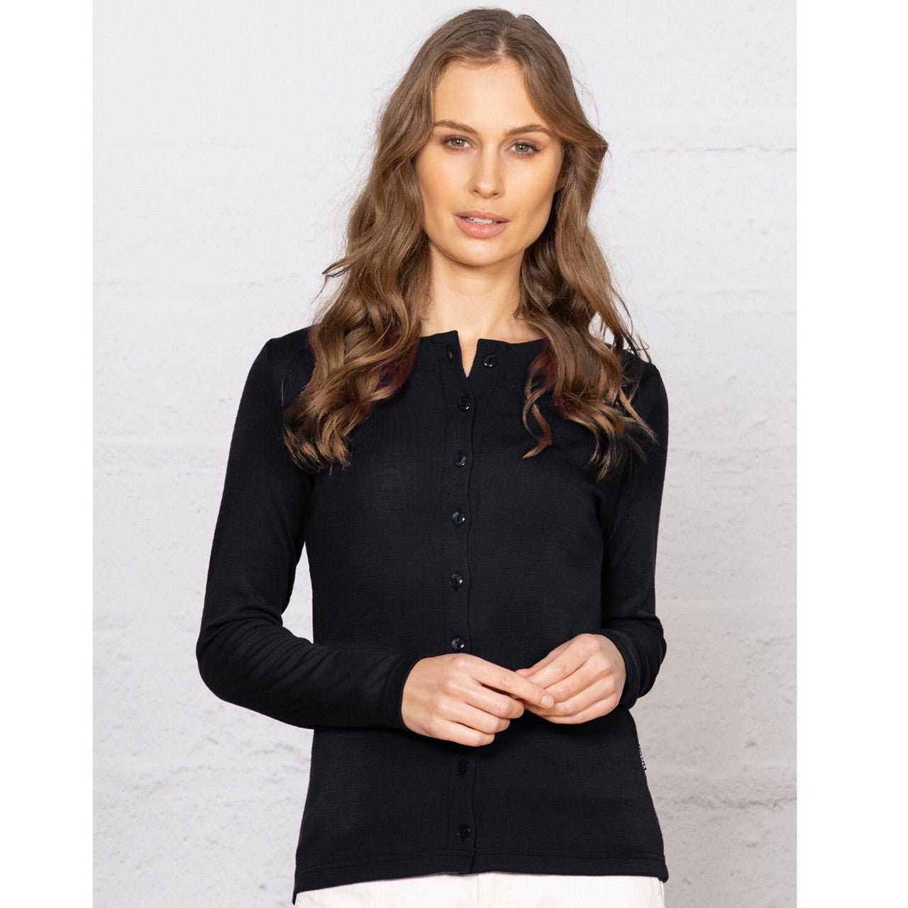 Woman wearing black cardigan.