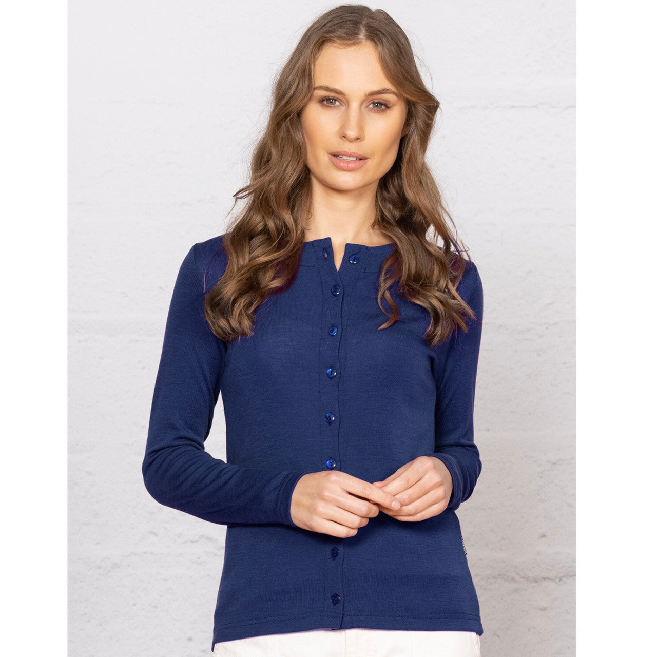 Woman wearing navy cardigan.