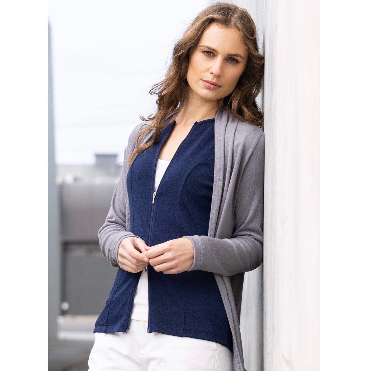 Woman wearing zipped Catherine Cardigan in Navy