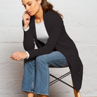 Woman wearing longline cardigan in  Black.