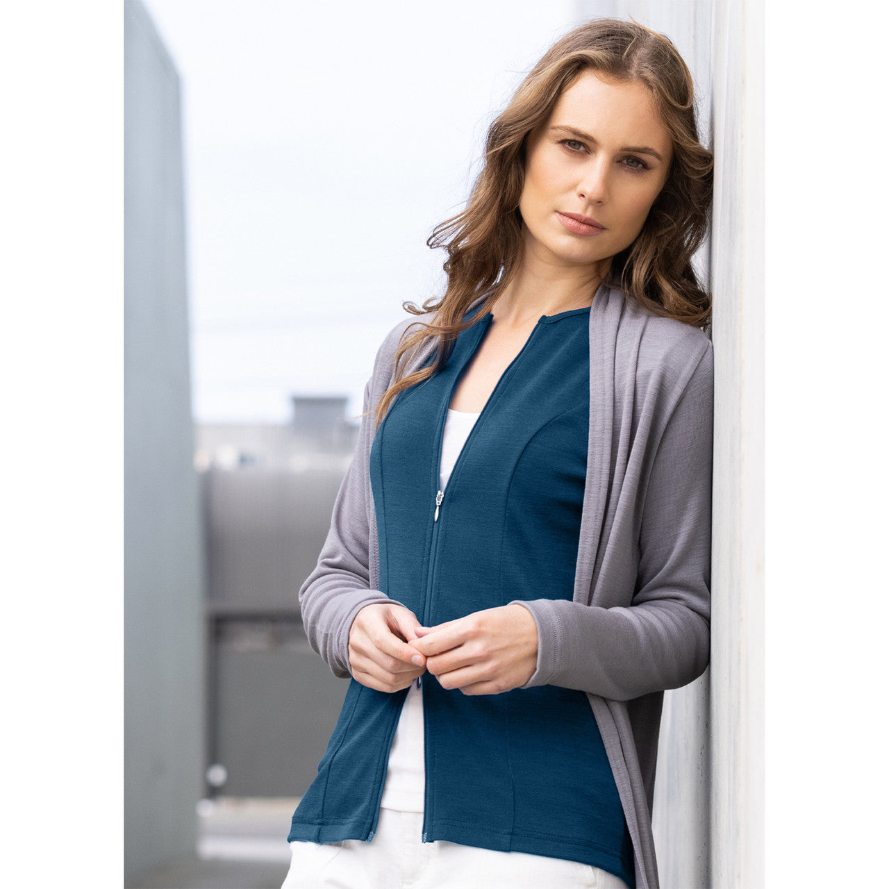 Woman wearing zipped Catherine Cardigan in Tui