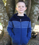 Boy standing wearing lagoon colour striped hoodie.