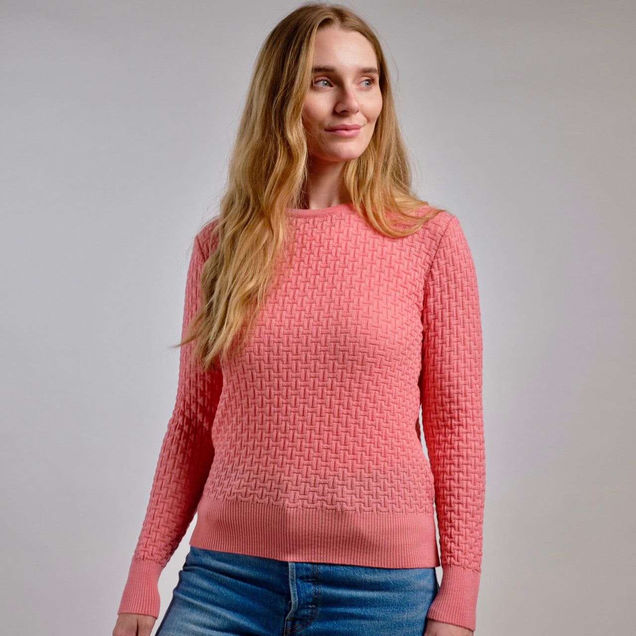 Woman wearing Country Laine - Merino Basketweave Jumper (CL0057) in the colour Peach.