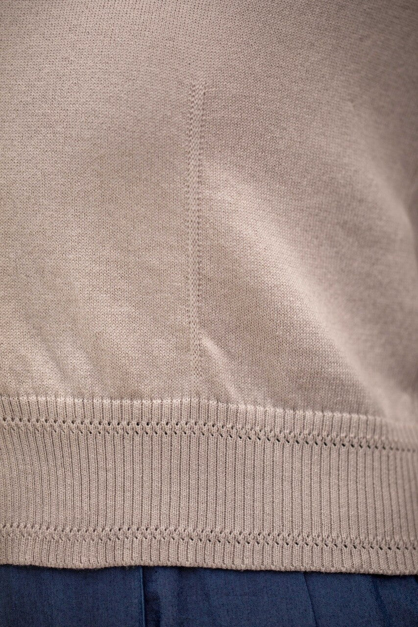 Woman wearing Country Laine - Cotton V Neck Cardigan (CL0093) in the colour Sand.